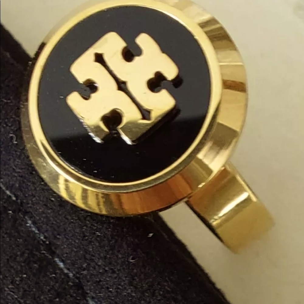 TORY BURCH LOGO RING ONYX BACKGROUND WITH GOLD PLATED LOGO. SIZE 8. LOVELY!!